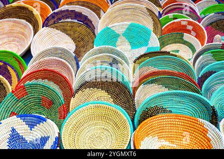 Alcudia Mallorca, Collection of handmade woven baskets featuring geometric patterns and beaded details. Traditional tribal handicrafts in bright color Stock Photo
