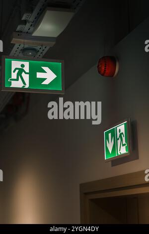 exit sign hotel business office interior illuminated sign escape direction emergency alert sirene Stock Photo