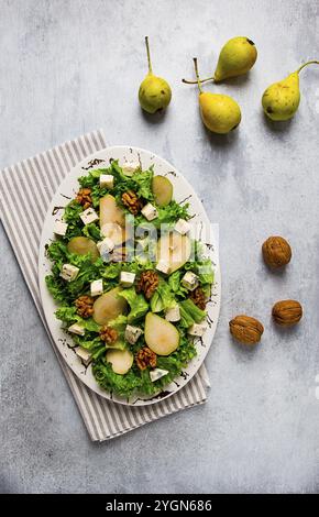 Keto Salad, pear with blue cheese and walnut, selective focus, no people, close-up Stock Photo