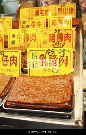 Macau, China, January 9, 2014: Assortment of Chinese preserved meat selling by the sidewalk of Macau, China, Asia Stock Photo