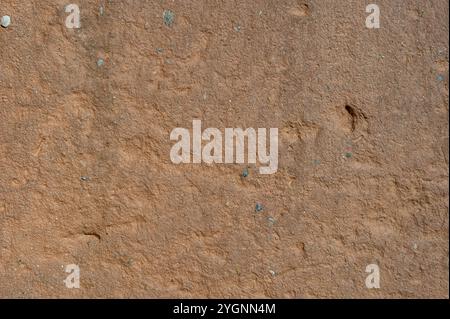 old brick wall plastered with clay sand and lime, washed by the rain Stock Photo
