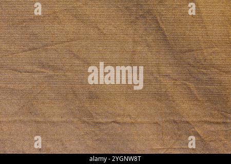 Brown fabric net or Jute cloth background with folds in rough texture Stock Photo