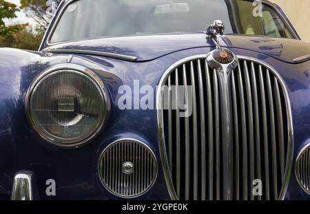 DUINO AURISINA, Italy - October 25, 2024: Close-up of the front of the Jaguar 240 vintage car, produced in the years 1967-1969 Stock Photo