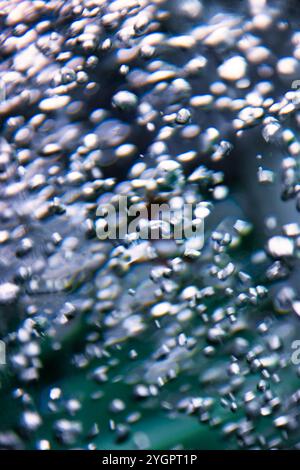 water air bubbles motion blur in a water cylinder reflections, abstract background Stock Photo