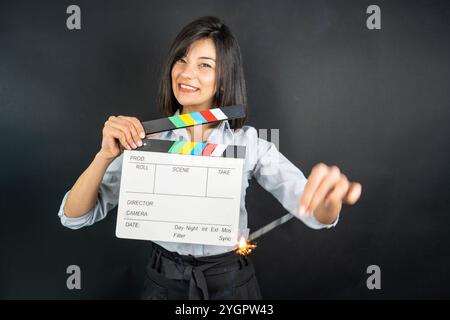 woman holding clapperboard Stock Photo