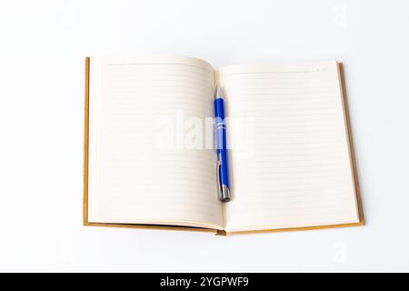 Lined notebook and blue pen, Open notebook isolated on white background. Journaling, writing idea concept. Nobody. Horizontal photo. Empty, blank. Stock Photo