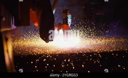 Cutting metal using a plasma laser close-up. Laser cutting of metal at the factory. Stock Photo