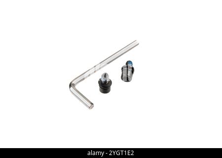 Screws and hexagons for screwing them in. Fasteners and tools. Isolate on a white background. Stock Photo