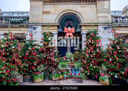Decorated Christmas trees displayed in Covent Garden, London, UK Stock Photo