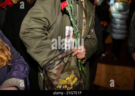 St. Petersburg, Russia. 7th Nov, 2024. A supporter of the Communist Party holds a newspaper featuring Stalin's portrait during the celebration of the 107th anniversary of the October Revolution in St. Petersburg. (Credit Image: © Andrei Bok/SOPA Images via ZUMA Press Wire) EDITORIAL USAGE ONLY! Not for Commercial USAGE! Stock Photo