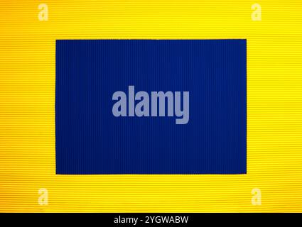 Yellow and blue corrugated paper background suitable for cards Stock Photo