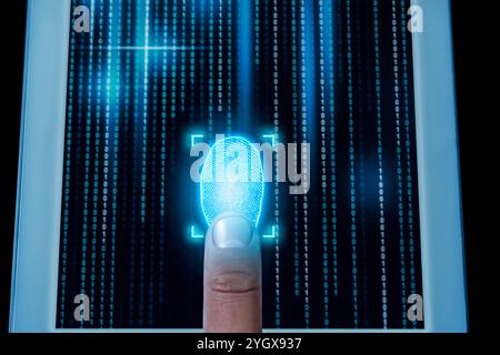 Man using fingerprint scanner in tablet by touching it, closeup Stock Photo