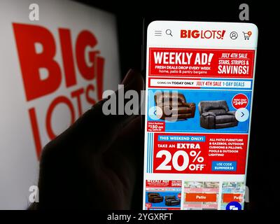 Germany. 6th July, 2024. In this photo illustration, a person is holding a smartphone with the webpage of US discount retail company Big Lots Stores Inc. in front of logo. (Credit Image: © Timon Schneider/SOPA Images via ZUMA Press Wire) EDITORIAL USAGE ONLY! Not for Commercial USAGE! Stock Photo
