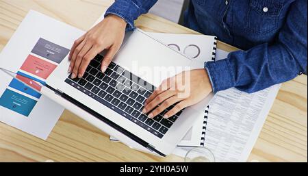 Laptop, paperwork and hands of businesswoman in office for typing creative project for art director. Technology, top view and female interior designer Stock Photo