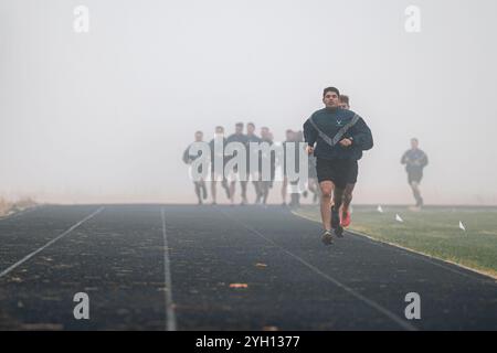 October 29, 2024 - Fairchild Air Force Base, Washington, USA - U.S. Airmen with the 66th Training Squadron's Survival, Evasion, Resistance, Escape pre-team 25-02, participate in a two mile run during a physical training test at Fairchild Air Force Base, Wash., Oct. 29, 2024. The SERE career field is one of few that require a unique PT test alongside the standard Air Force PT test. The SERE test includes pull-ups, push-ups, sit-ups, a two mile run and a four mile ruck. (Credit Image: © Tiffany Del Oso/U.S. Air Force/ZUMA Press Wire) EDITORIAL USAGE ONLY! Not for Commercial USAGE! Stock Photo