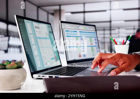 Medical Account Manager In Office Analyzing Billing Codes Stock Photo