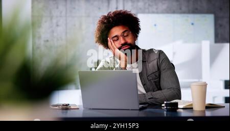 Stressed Sick African American Employee Man At Computer Stock Photo