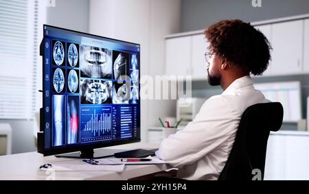 Radiologist Dentist Using X Ray Software On Desktop Computer Stock Photo