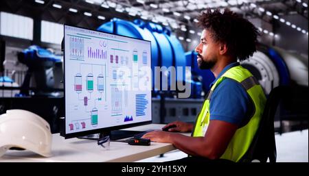 African American Man Controlling Heating Pipes At Gas Plant Stock Photo