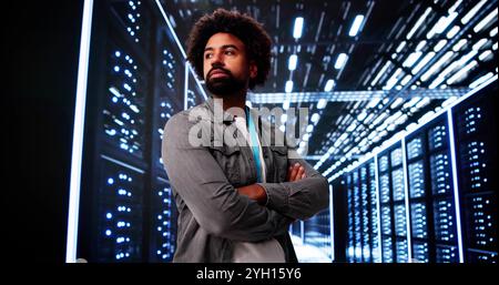 Cloud Computer Engineer In Server Room In Data Center Stock Photo