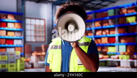 African Speaker Announce News In Megaphone. Excited Man Shouting Stock Photo