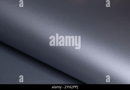 Glossy designer paper background with a sleek metallic slate gray gradient, featuring wavy, reflective textures and subtle curves. This luxurious, mod Stock Photo