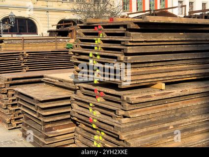 stacks of wooden pallets on a construction site Stock Photo