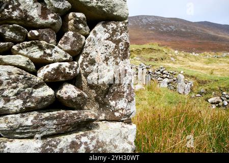 close up of corner stones of stone wall construction of a ruined house in slievemore deserted village achill island, county mayo, republic of ireland Stock Photo