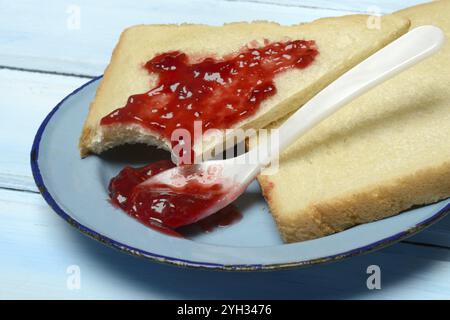 Toast with raspberry jam on a plate, breakfast Stock Photo