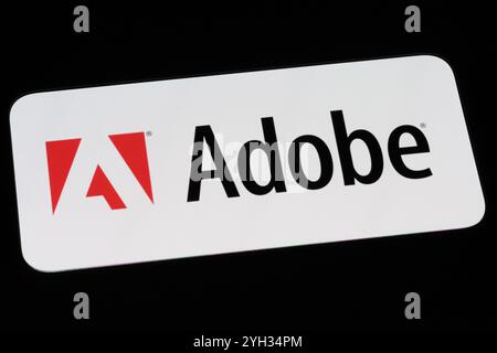 Adobe company brand logo on phone screen Stock Photo