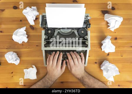 Writer's block. Typewriter and crumpled paper on work desk. Creative process concept Stock Photo