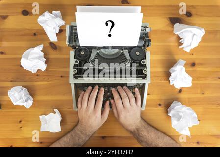 Writer's block. Typewriter and crumpled paper on work desk. Creative process concept Stock Photo