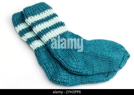 Warm, woolen knitted socks isolated on white background. Warm socks made of wool for winter season. Stock Photo