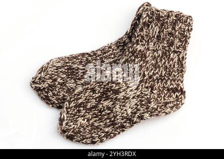 Warm, woolen knitted socks isolated on white background. Warm socks made of wool for winter season. Stock Photo