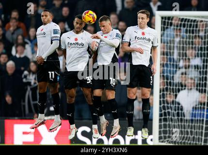 (left to right) Derby County's Nathaniel Mendez-Laing, Curtis Nelson, Jerry Yates and Craig Forsyth defend a freekick during the Sky Bet Championship match at Pride Park, Derby. Picture date: Saturday November 9, 2024. Stock Photo