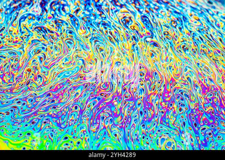 Closeup on a soap bubble movement as a scientific experiment showing light diffraction with colorful shapes and forms Stock Photo
