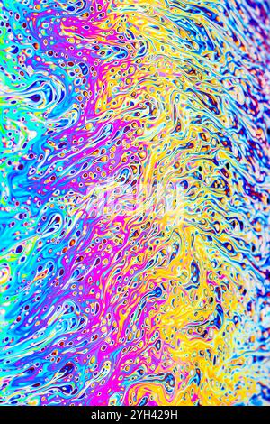 Closeup on a soap bubble movement as a scientific experiment showing light diffraction with colorful shapes and forms Stock Photo