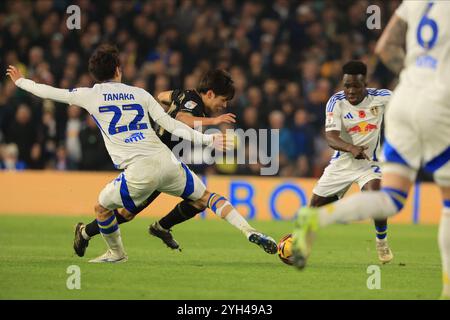 Ao Tanaka of Leeds United is fouled by Luke Cundle of Millwall during ...