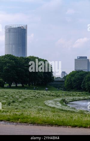 View of the beautiful public park Rheinaue, the corporate headquarters building of the German post and the United Nations building in Bonn Germany Stock Photo