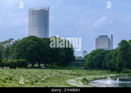 View of the beautiful public park Rheinaue, the corporate headquarters building of the German post and the United Nations building in Bonn Germany Stock Photo