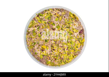 Turkish Halva with tahini and pistachio isolated on a white background. top view. Stock Photo