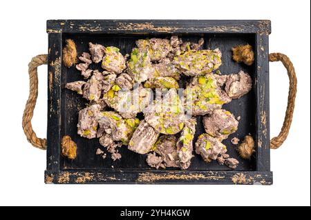 Arabic Halva with pistachio isolated on a white background. Natural vegan sweets. Stock Photo