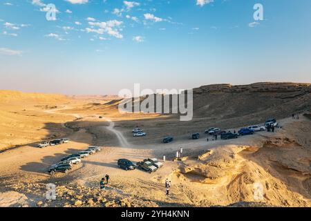 Tourist on Edge of the World, a natural landmark and popular tourist destination near Riyadh -Saudi Arabia.18-December-2019. Stock Photo