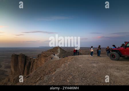 Tourist on Edge of the World, a natural landmark and popular tourist destination near Riyadh -Saudi Arabia.18-December-2019. Stock Photo