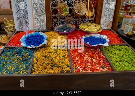 Moroccan colorful spices and herbs displayed in the boxes for sale in Morocco. Stock Photo