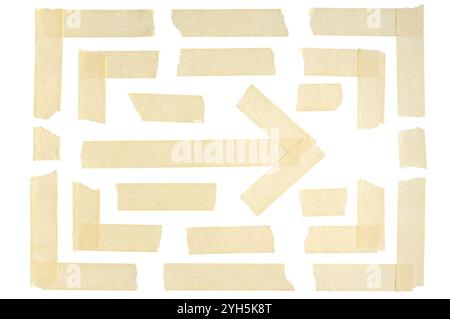 Duct tape and adhesive paper are arranged to form corners and arrow. Strips and pieces of wrinkled masking tape isolated on a white background. Stock Photo