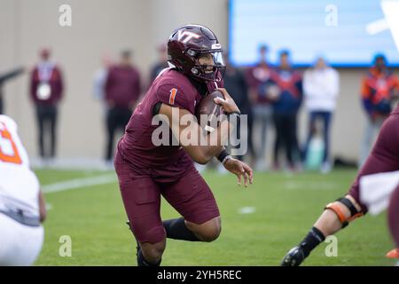 Blacksburg, VA, USA. 9th Nov, 2024. Virginia Tech Hokies quarterback Kyron Drones (1) scrambles with the ball during the NCAA football game between the Clemson Tigers and the Virginia Tech Hokies at Lane Stadium in Blacksburg, VA. Jonathan Huff/CSM/Alamy Live News Stock Photo