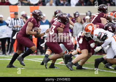 Blacksburg, VA, USA. 9th Nov, 2024. Virginia Tech Hokies quarterback Kyron Drones (1) scrambles with the ball during the NCAA football game between the Clemson Tigers and the Virginia Tech Hokies at Lane Stadium in Blacksburg, VA. Jonathan Huff/CSM/Alamy Live News Stock Photo