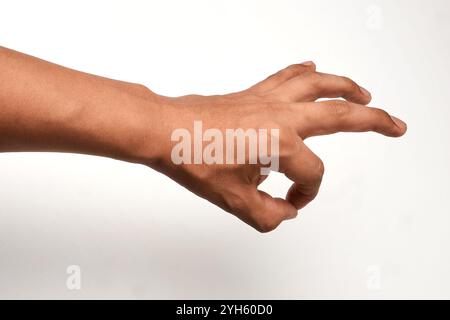 Hand of a Latin man pointing up thumbs up gesture, man making a thumbs up gesture, Stock Photo