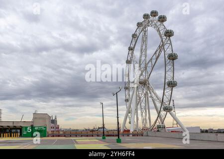 Melbourne Eye observation and ferris wheel, on an overcast winters day with car park in view Stock Photo